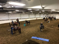 cowboy challenge riders in arena