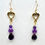 Thumbnail: These handmade gemstone earrings include Amethyst briolettes & Lepidolite beads dangling from a gold heart charm.