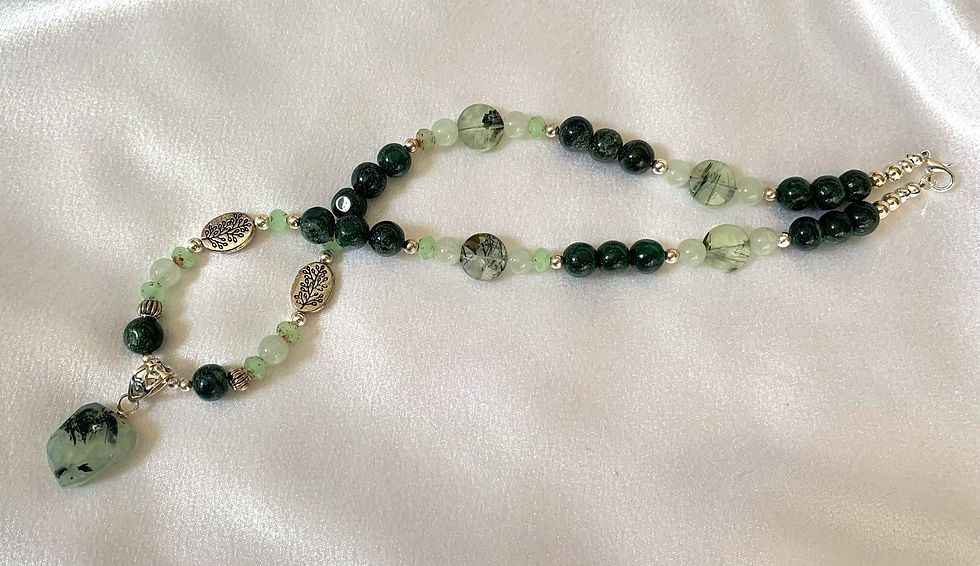 Thumbnail: This handmade gemstone necklace includes a cut Green Prehnite dangling on a strand of Prehnite, Jasper & silver plated beads.