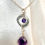 Thumbnail: This handmade gemstone necklace includes an Amethyst briolette on a silver plated chain with Freshwater Pearl & Amethyst.