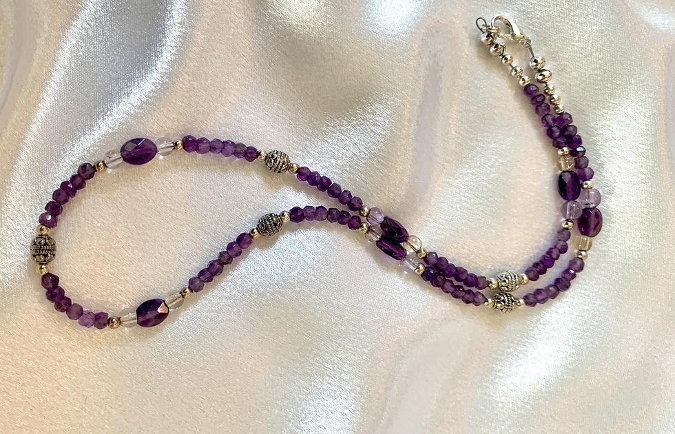 This handmade gemstone necklace includes a strand of Lavender Quartz & Amethyst plus decorative silver plated beads.