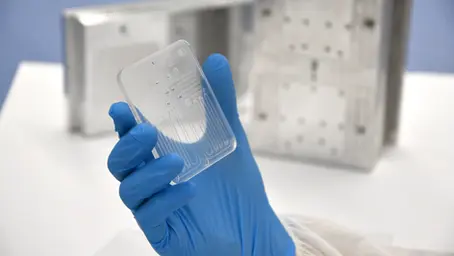 Production-scale PMMA microfluidic chip for point-of-care diagnostic systems.