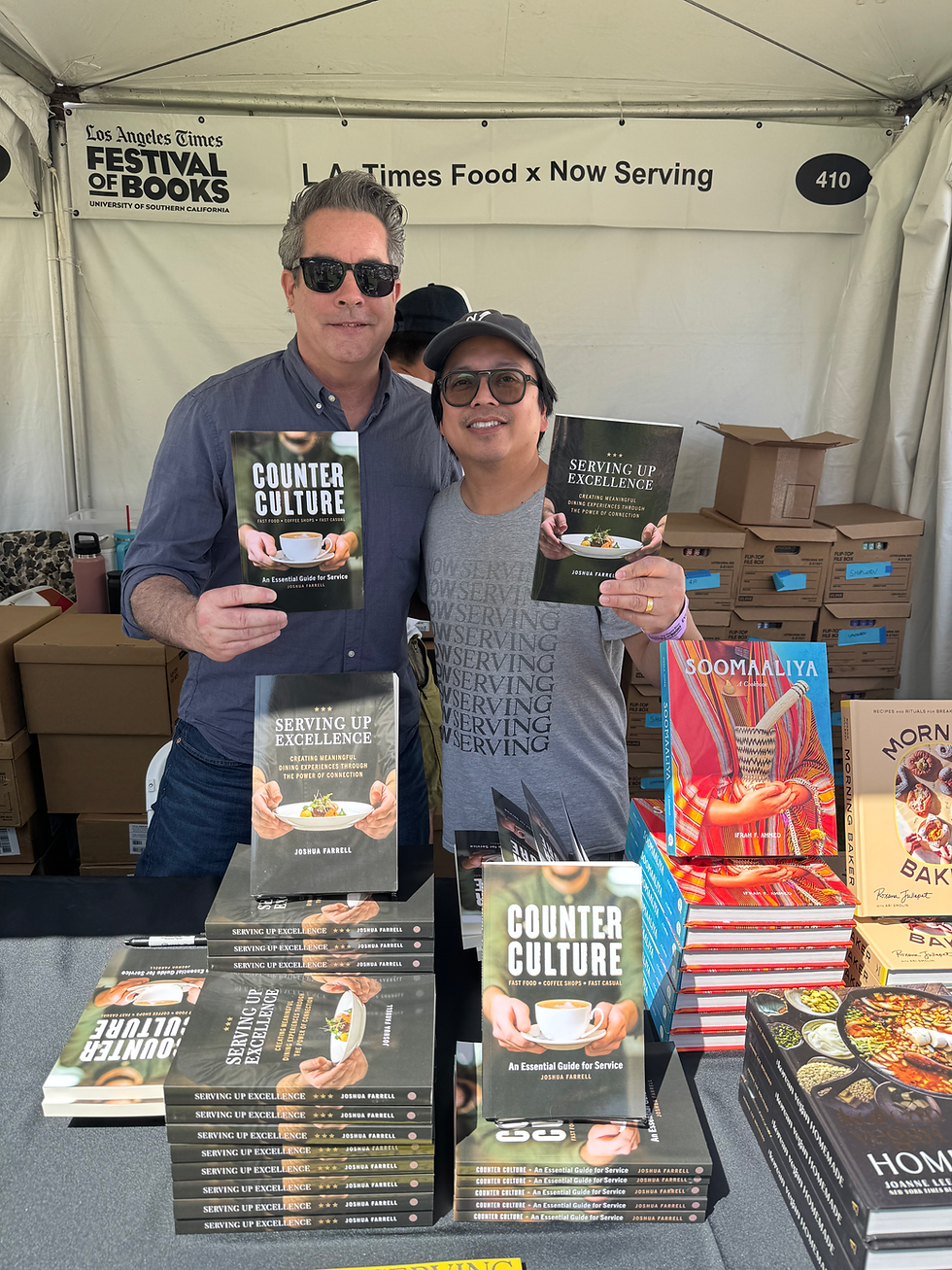 Joshua Farrell with Ken Concepcion, owner of Now Serving during Joshua's signing of both of his hospitality books at the L.A. Times Festival of Books.