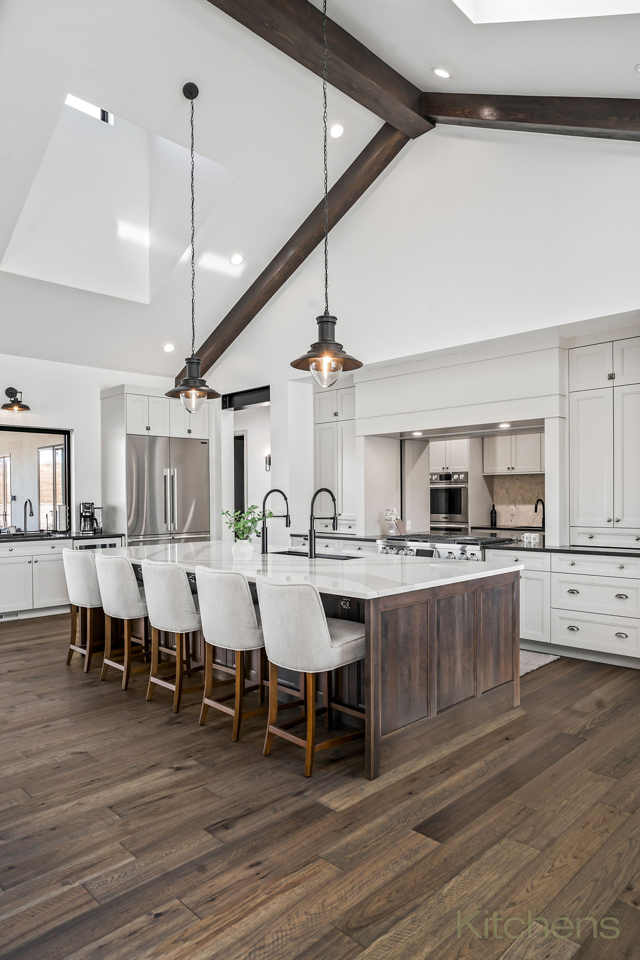 White luxury kitchen with a modern farmhouse vibe, SKS appliances, Parade of Homes featured. 