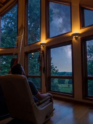 Man inside the Spirit Lodge gazing at the Sars