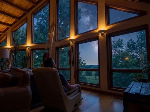 Man inside the Spirit Lodge gazing at the Sars