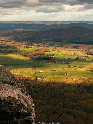 Rural landscape in Etlan, Virginia with open fields, tree lines, and Blue Ridge foothills in the distance