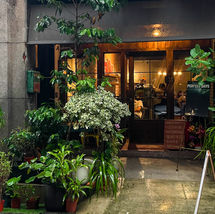 Perfect Days coffee in Taiwan, with plants around the entrance