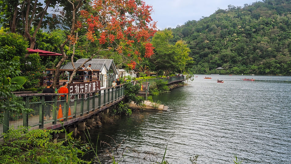 Liyu Lake, near Hualien. A fenced path is to the left, with trees overhanging it