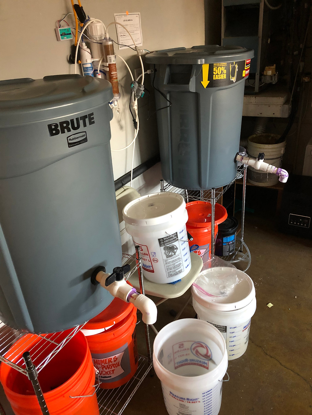 Salt water mixing station using two Brute trash cans, RO/DI unit and float valves