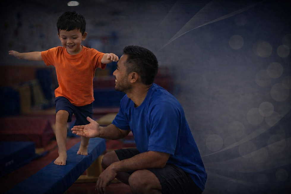 Coach high-fiving a child at Jumpstart Gym