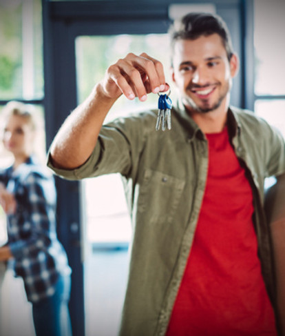 couple with keys in new house