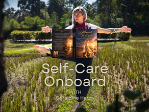 Geraldine Hardy balancing outdoors in a natural field holding her book Moments That Matter, symbolizing personal growth, identity transformation, and self-care journey