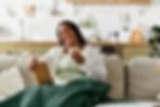 young-african-american-woman-enjoys-peaceful-morning-home-with-book-tea.jpg