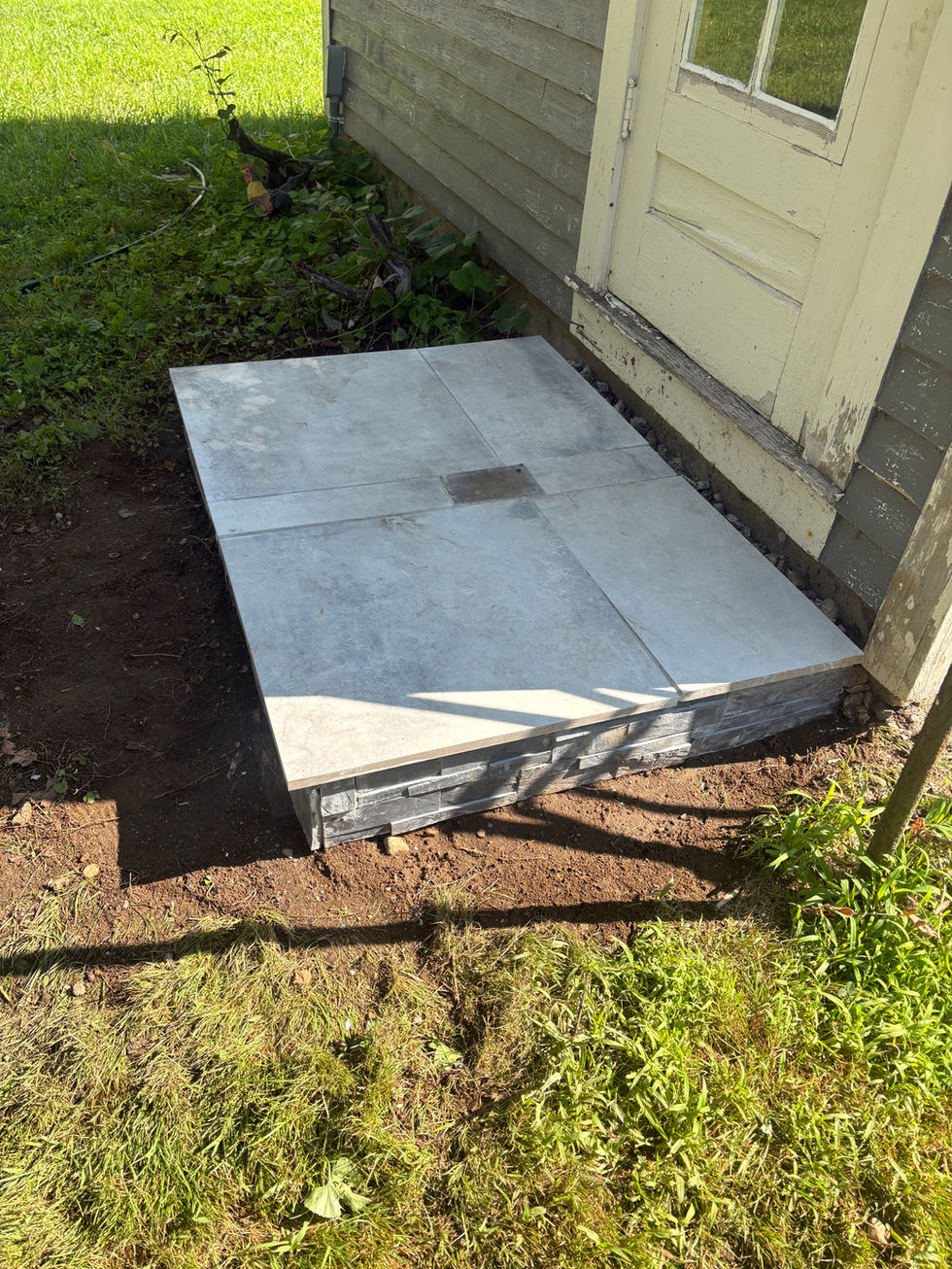 Custom stair entry landing in bluestone and marble