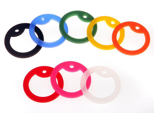 A fotographic image showing logo-2-go's rubber edging rings, available in eight colours, for use with our ID-tags.
