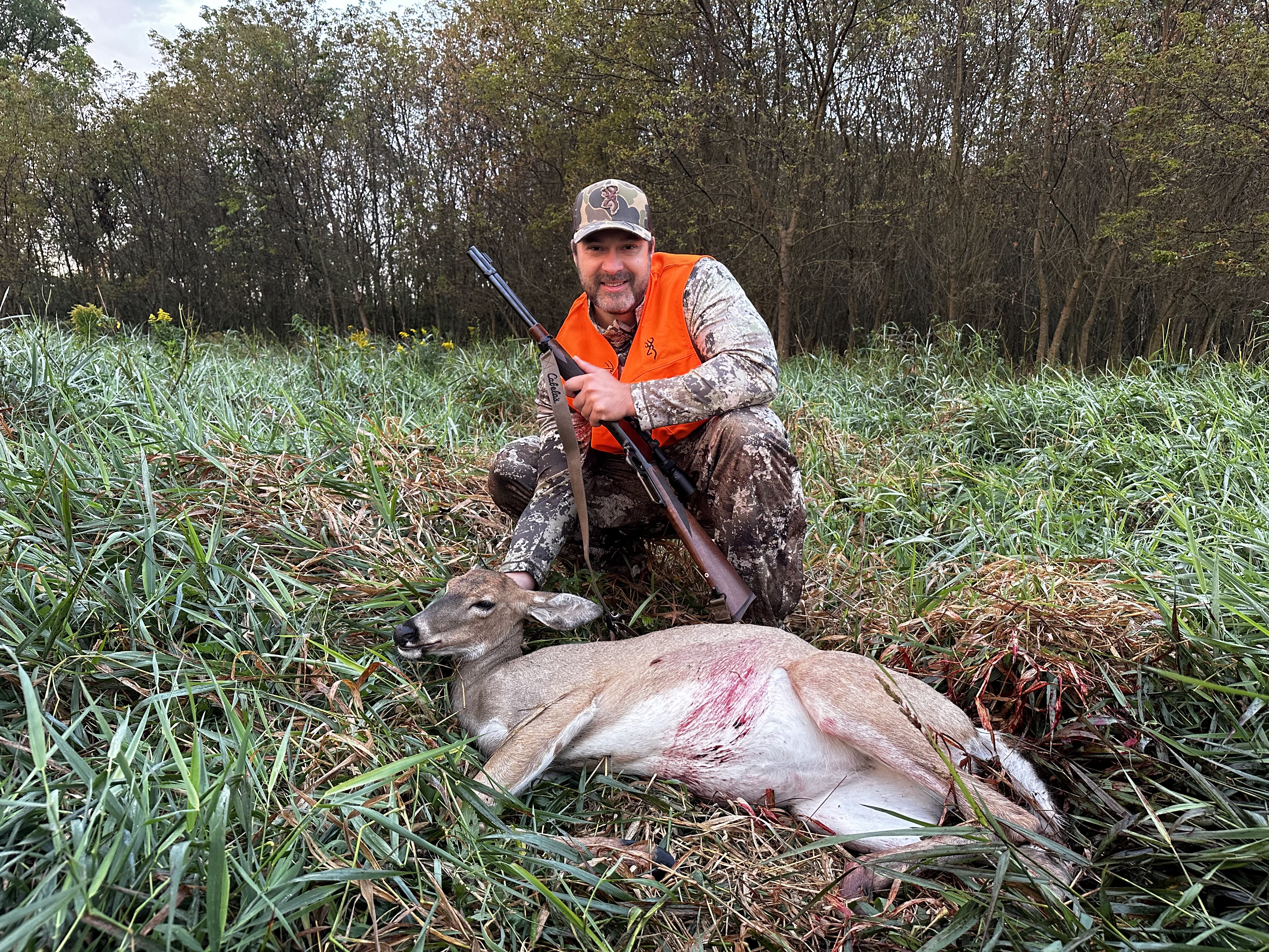 Alex celebrating his first deer hunt