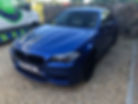 Blue BMW parked for mobile ECU remapping service.
