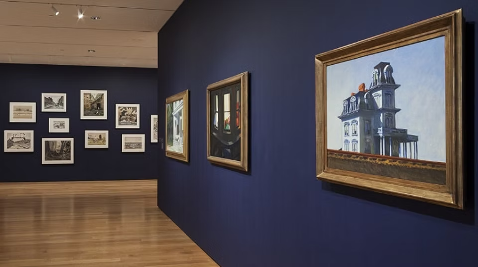 Foreground rail blocking the frame with a full view of the house beyond