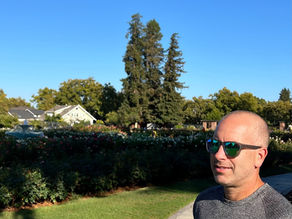 Robert Gosalvez walking through a Silicon Valley residential neighborhood, reflecting on long-term real estate decision-making