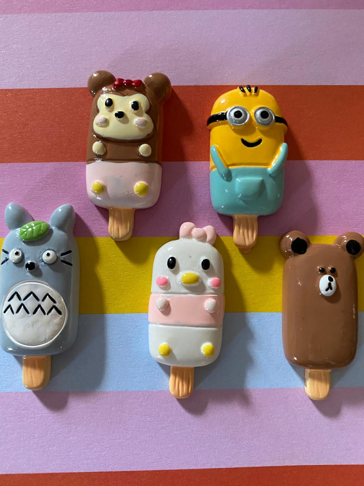 A SET OF FIVE MINIATURE ICY POLE WITH CHARACTERS TOYS