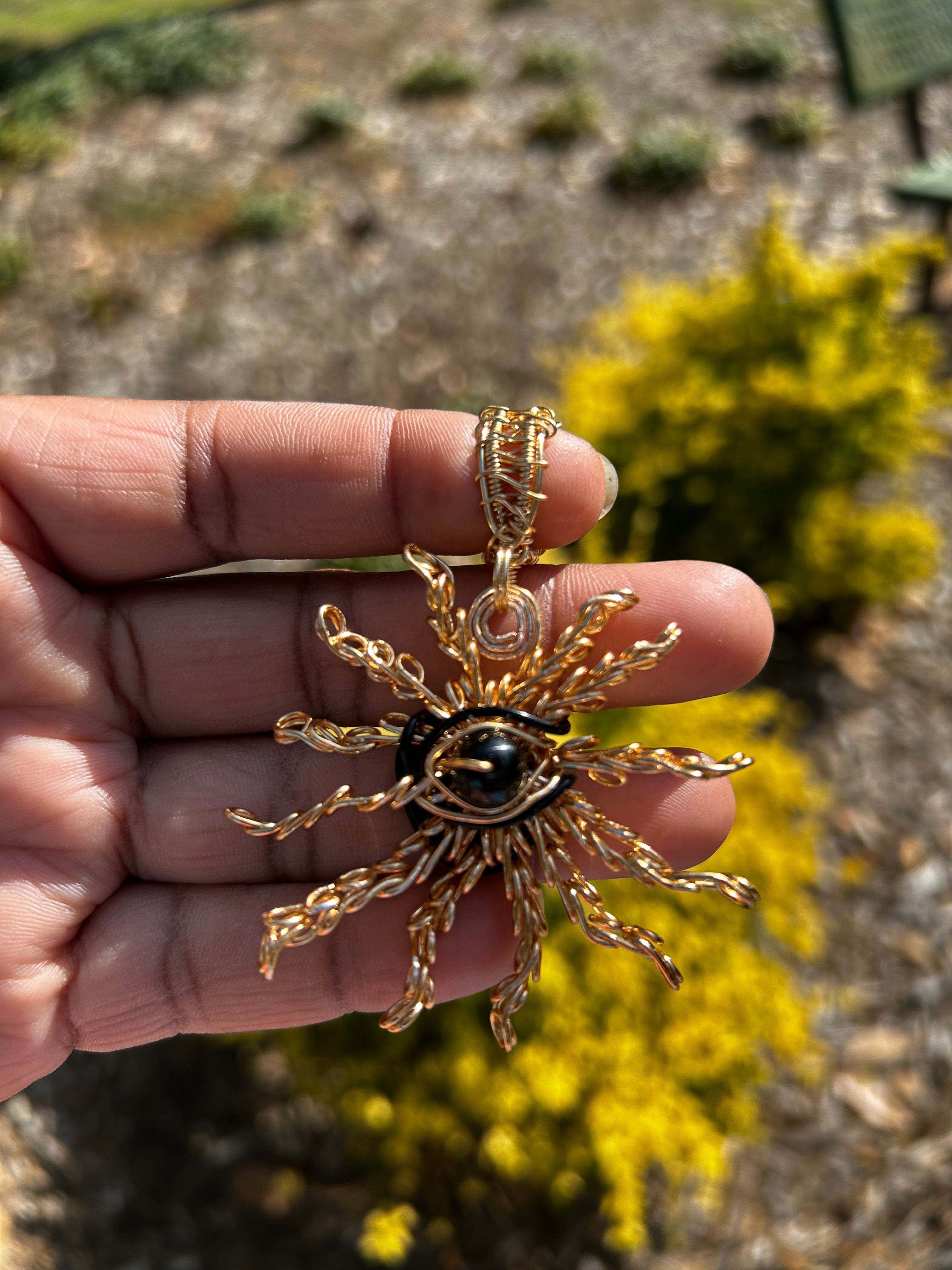 Eye of the Sun pendant with swing bale