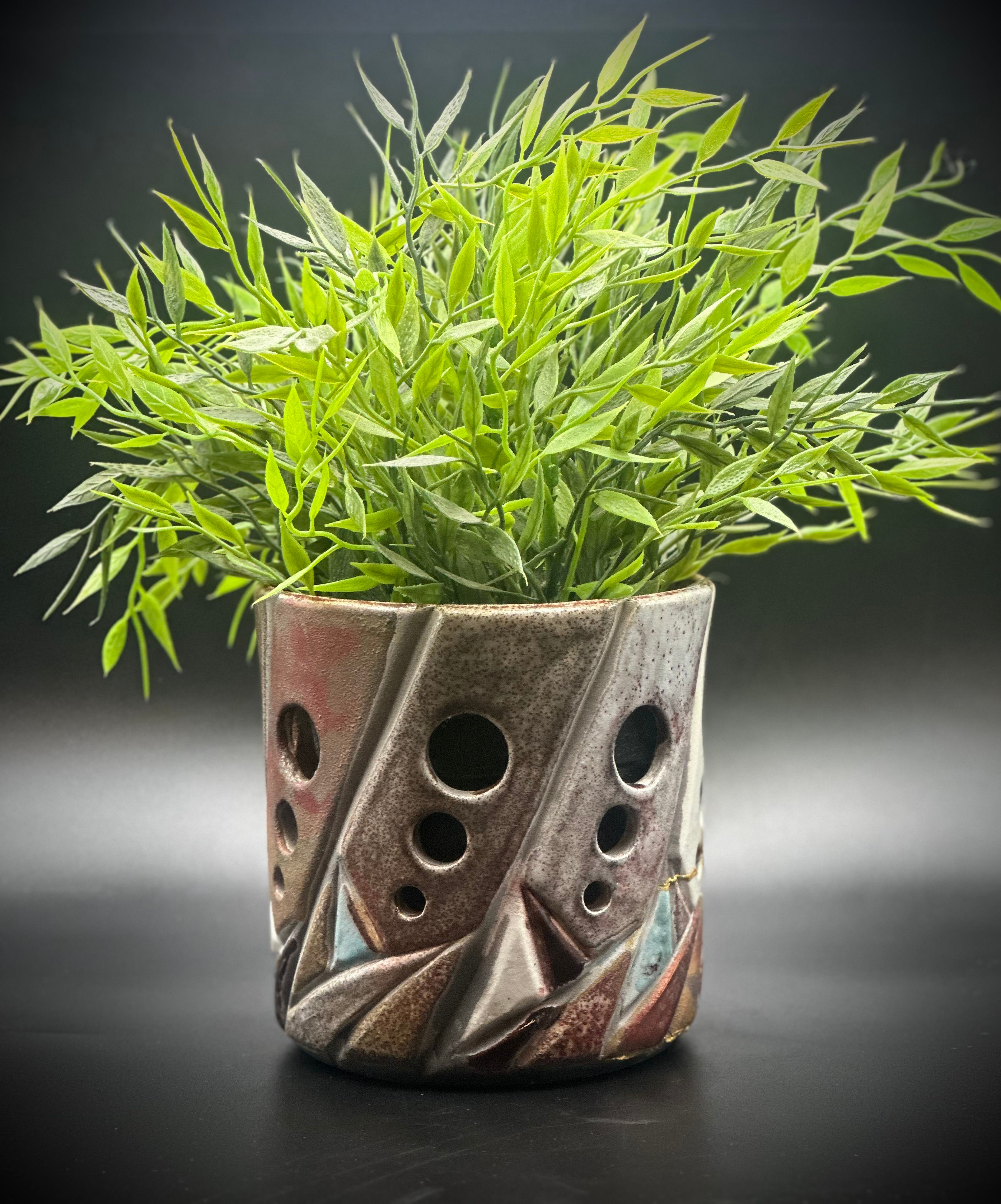 Raku fired versatile wine-bottle holder, flower pot or a candle holder