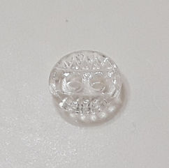 Clear glass two-hole button. Sides of the surface have a bumpy texture.
Sizes: 14 ligne