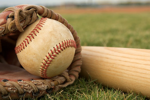 a-baseball-in-a-glove-and-a-baseball-bat