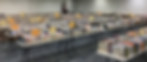 Rows of tables in a huge room at the annual friends book sale