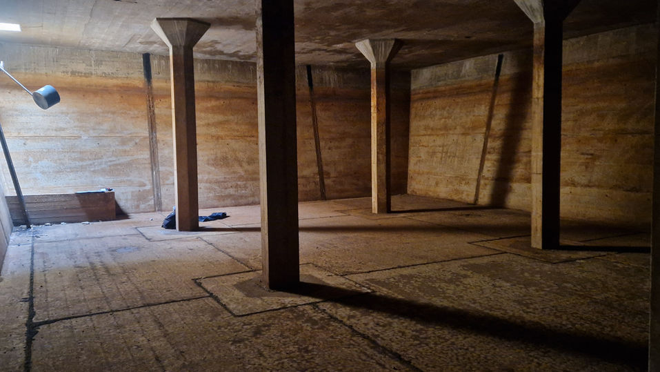 Kode Architecture. Reservoir conversion. flint, timber cladding, inset balconies, resevoir conversion. Former reservoir, underground house, house in hill, Reservoir dwelling. Architect. Sandy Reservoir. House in countryside. Planning countryside. Planning Application countryside Grand Design water reservoir. Water reservoir conversion. Subterranean house. Eco house. Architecture. Timber and glass architecture. Water reservoir architecture. Concrete and glass. Green Roof. Water storage tank conversion. Concrete. Former water tower.