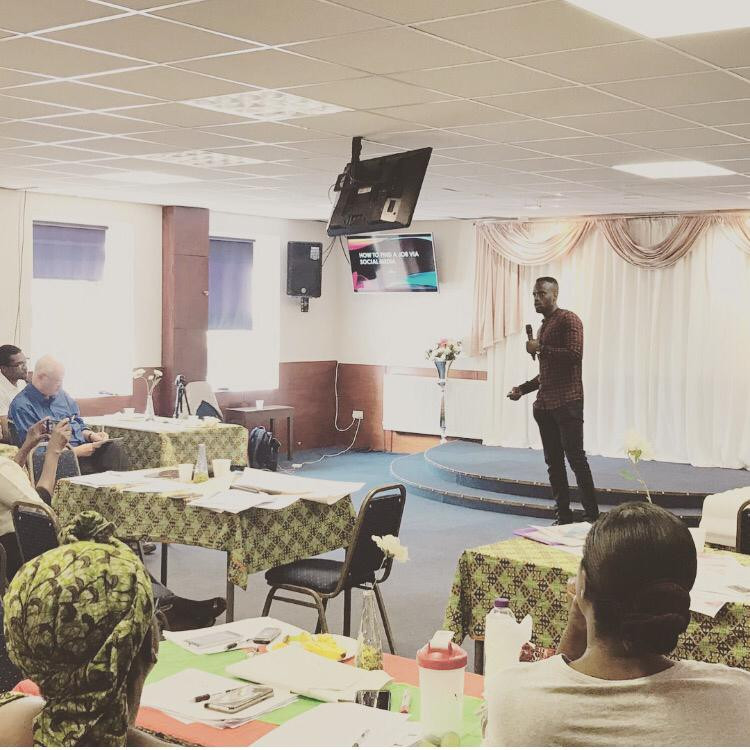 Imisi giving a speech in front of the National Careers Service