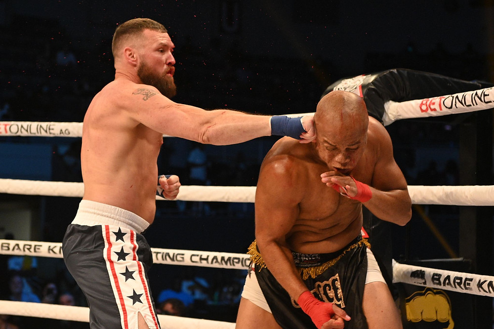 Ryan Jones (left) tags Robert Washington with a punch at BKFC 17 - Photo by Phil Lambert for Bare Knuckle FC