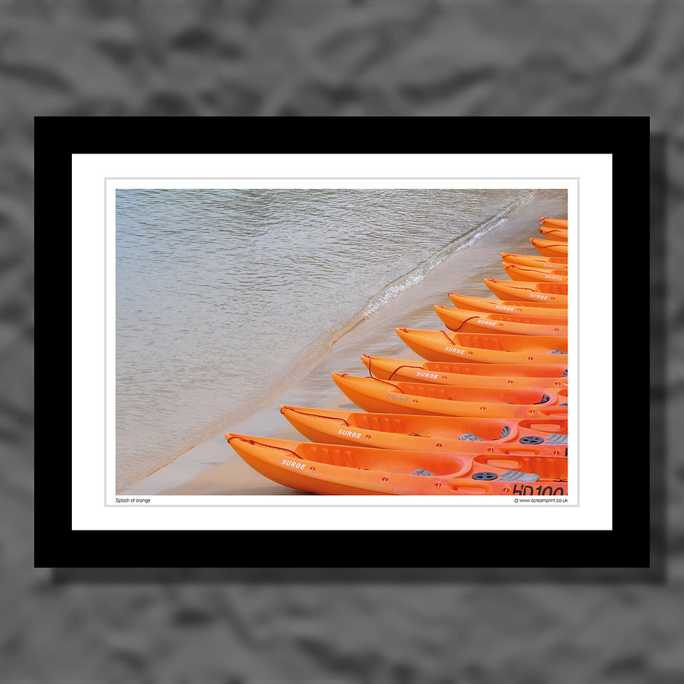 Thumbnail: A collection of orange canoes. Colour photograph.
