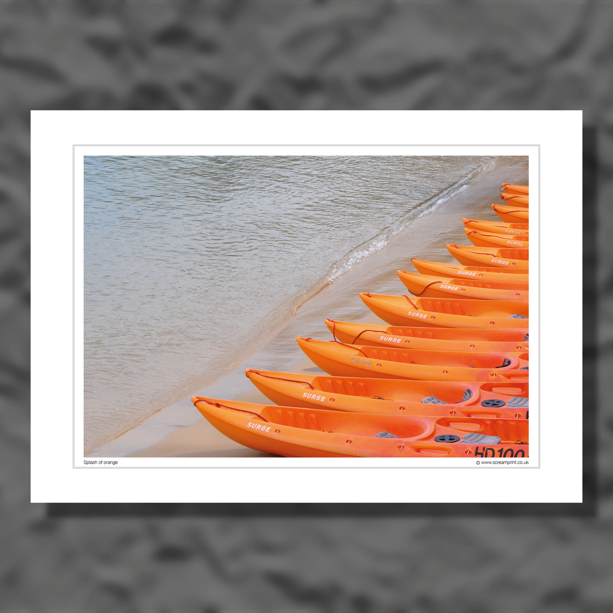 A collection of orange canoes. Colour photograph.