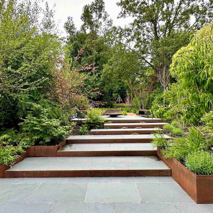 Barnet London landscape design - slate patio with Corten steps and planters - CITYSCAPERS  