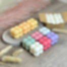 Pastel bubble candles with white candles in a box