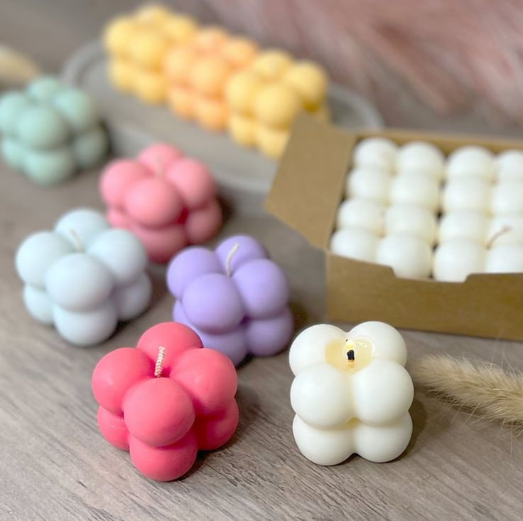 Thumbnail: Collection of colorful mini bubble candles, one lit