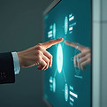Person touches futuristic screen showing graphs