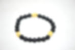 Armband mit ONYX-Perlen und goldfarbenen Fragmenten