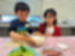 Two children engaged in a collaborative learning activity during a preschool session at Intelligent