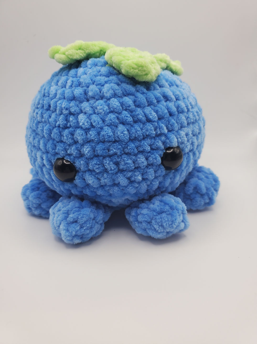 Thumbnail: blue octopus with green leaves