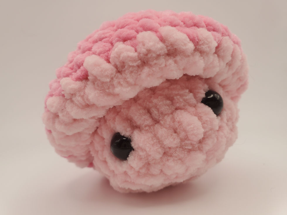 Thumbnail: pink mushrom crocheted plush with a darker pink cap