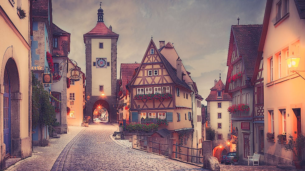 Save money on travel by choosing small villages like this one, Rothenburg ob der Tauber, in Germany. ©AlonzoWright