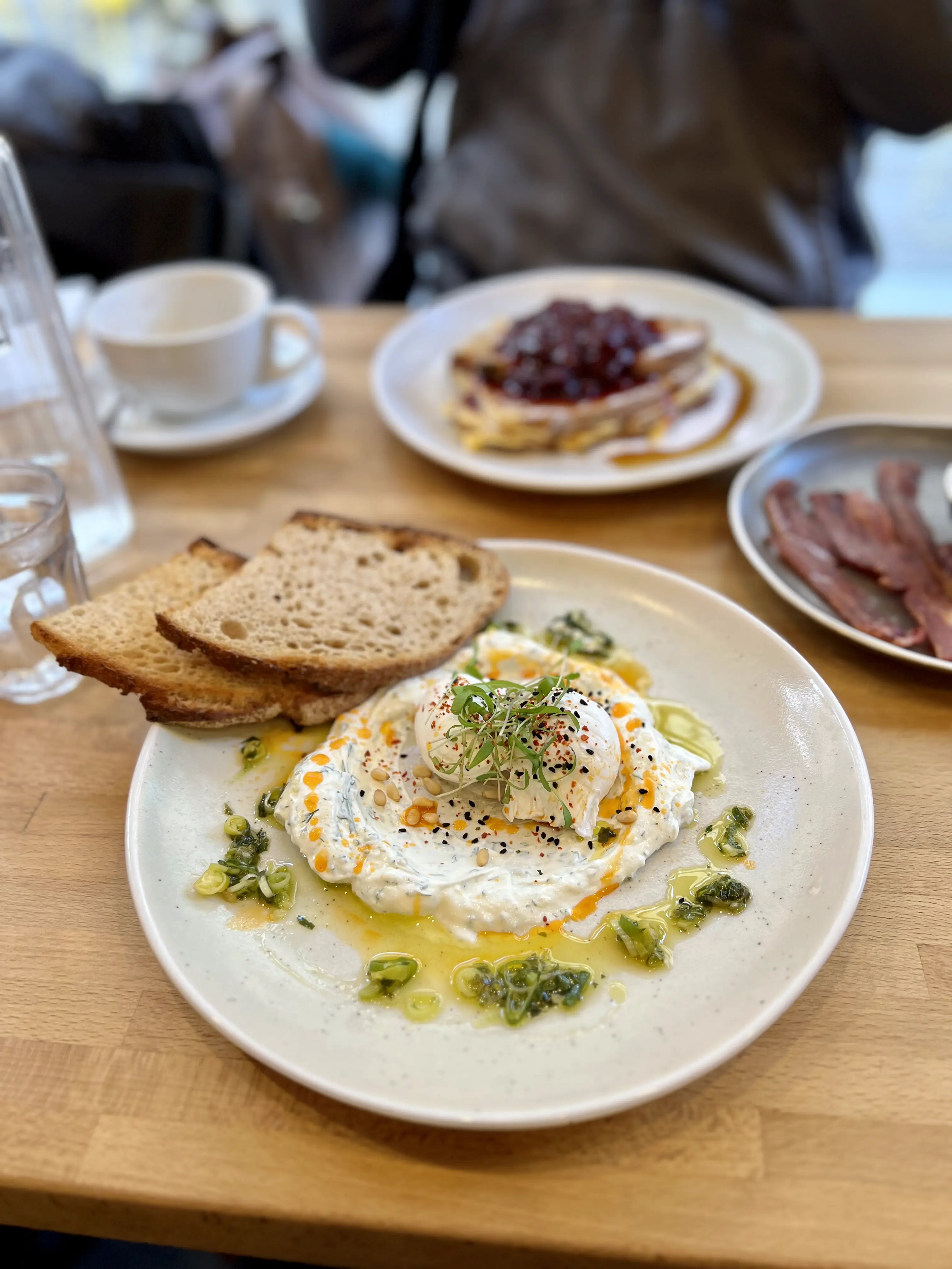 A plate of Turkish Eggs served at The Green Bird Cafe restaurant in Bath UK are a local favorite @AOnozWright for Manifesting Travel ©AOnozWright