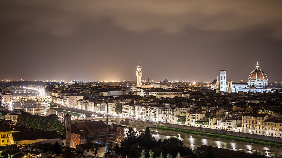 Travel saving tip: go during the off season to a beautiful city like Florence, Italy with the River Arno and the Duomo and city lights sparkling. ©AlonzoWright
