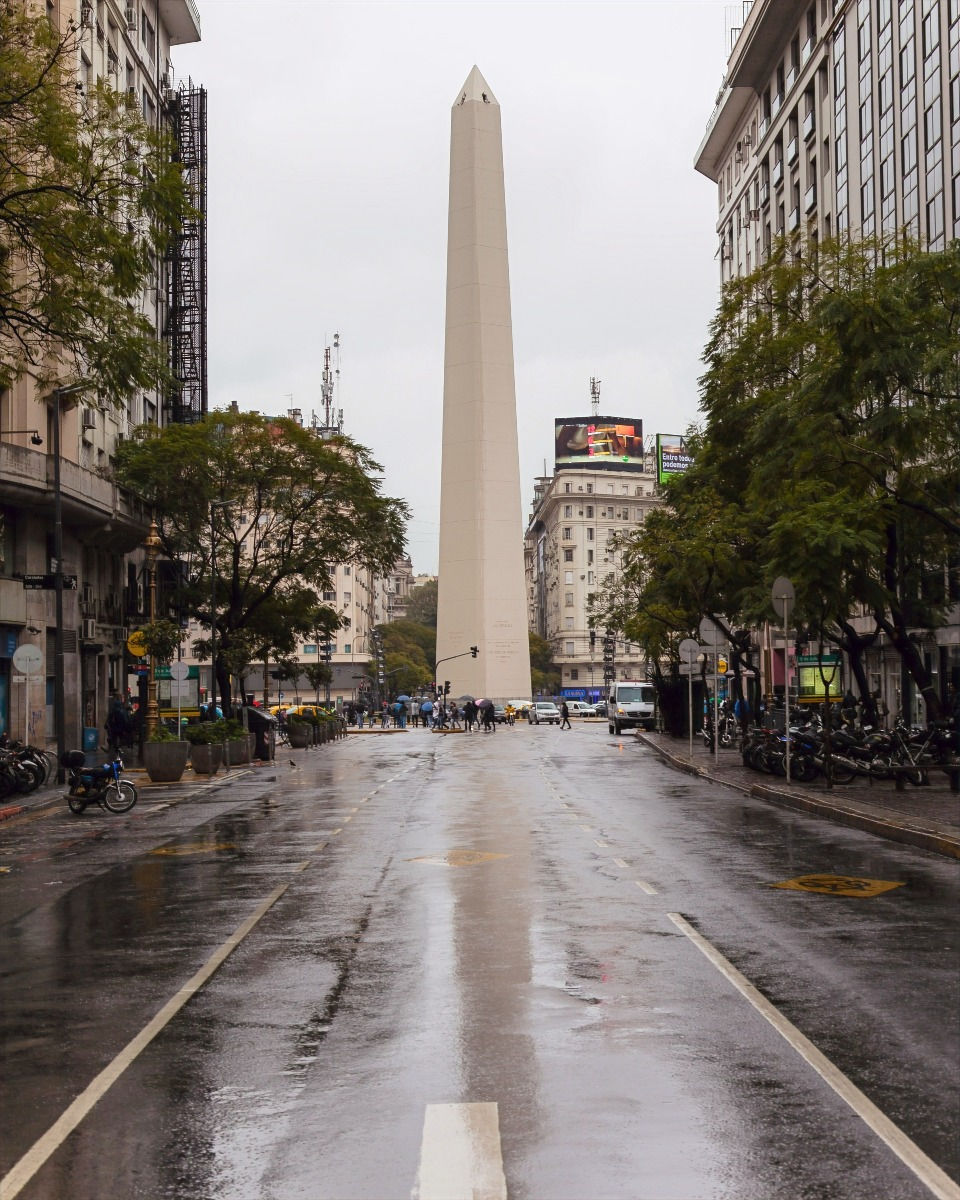 A white marble obelisk stands in the center of a city square, the Plaza de la Republica in the city of Buenos Aires, it's a must see attraction ©AlonzoWright for Manifesting Travel