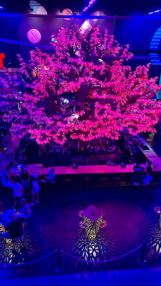 Oddwood, the digital maple tree in the center of the space changes colors and glows at Area 15 in Las Vegas, one of the things to do in Vegas with kids featured in Manifesting Travel. ©AOnozWright