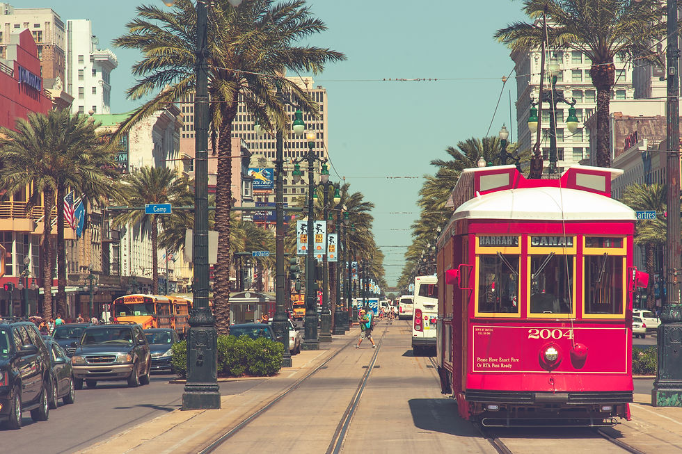 The red Canal Street cable car in New Orleans snapped on a trip where we used Google Flights to save money on travel. ©AlonzoWright