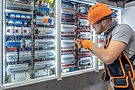 male-electrician-working-electrical-panel-male-electrician-overalls_169016-67274.jpg